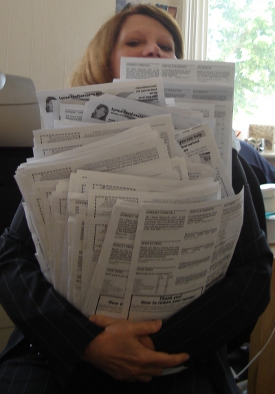 With my arms full of residents' surveys