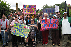 Lynne Featherstone at the FAITH garden centre, with protestors