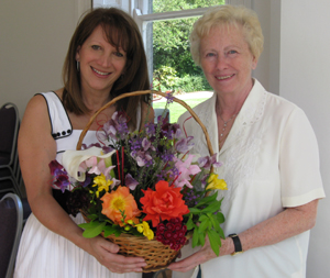 Lynne Featherstone getting arrangement from Marion Wilton