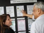 Lynne Featherstone MP being shown the activities offered by the Asian centre by Dipak Jashapara, Project Coordinator.