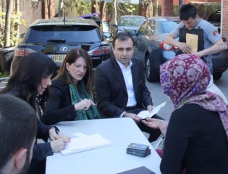 Lynne Featherstone MP and Dr Turhan Ozen (Liberal Democrat European Parliamentary Elections Candidate for London) with congregation members