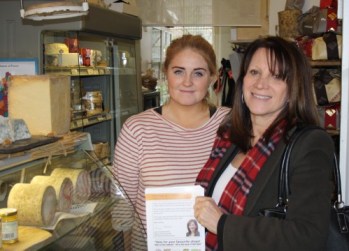 Lynne Featherstone MP with nomination forms in an independent shop