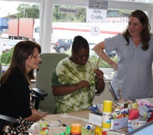 Lynne Featherstone MP with one of the children who attends Action for Kids, and a volunteer