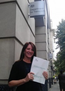 Lynne Featherstone MP outside the Department for Transport, holding the document which confirms there will be no losses of services at Hornsey and Harringay
