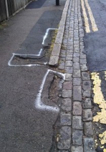 Lightfoot Road in Hornsey, where a man suffered brain injury as a result of tripping in a pothole. Some potholes have been filled but others (which had been marked for repair) were left untouched. 