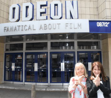 Lynne Featherstone MP and Councillor Gail Engert keep their fingers crossed for the new police front counter at Muswell Hill Odeon to be opened