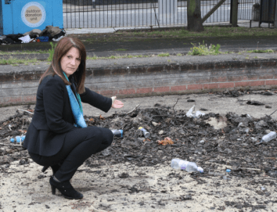 Lynne Featherstone MP inspecting the rubbish at the old pond
