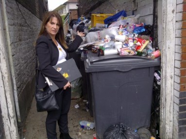 Lynne Featherstone MP on Lordship Lane, with the pile of uncollected and dumped rubbish 