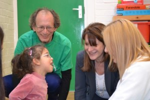 Lynne Featherstone MP and marathon runner David Schmitz with LCCP pupil Amani